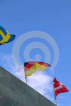 The Germany Flag Waving on Top of the Building with Other Nations\' Flags