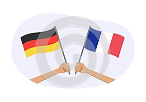 Germany and France flags. French and German national symbols. Hand holding waving flag. Vector illustration