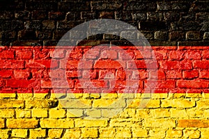 Germany in German, Bundesrepublik Deutschland national flag painted on a brick wall.