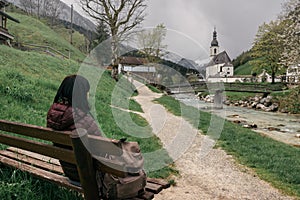 Germany. Ramsau. The girl traveler rests