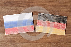 Germany and Russia flag, concept cooperation friendship on wood background