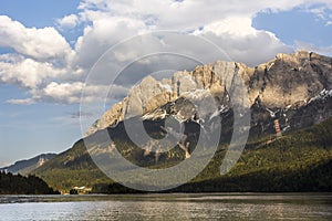 Germany`s highest mountain Zugspitze in front of lake Eibsee in the Wetterstein Mountains south of the town Garmisch-Partenkirchen