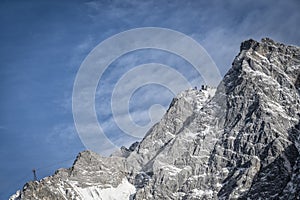 Germany`s highest mountain, the Zugspitze, with the Tyrolean mountain ropeway photo