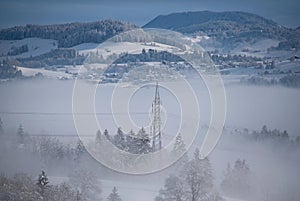 Germany, Scheidegg, Alps - December 08, 2020: Panoramic view with Alps in a foggy winter days.