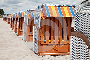 Germany, Schleswig-Holstein, Baltic Sea, closed beach chairs at