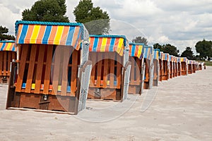 Germany, Schleswig-Holstein, Baltic Sea, closed beach chairs at
