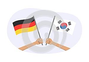 Germany and South Korea flags. Korean and German national symbols. Hand holding waving flag. Vector illustration