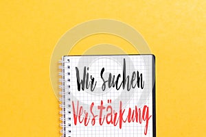 Germany text Wir suchen VerstÃÂ¤rkung on notebook which means we are looking for reinforcement. photo