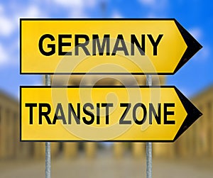 Germany and Transit zone traffic sign with blurred Berlin background