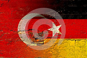 Germany and Turkey flag on old wood.