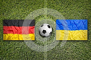 Germany vs. Ukraine flags on soccer field