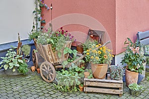 Germany, wooden wagon full of flowers