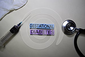 Gestational Diabetes text on Sticky Notes. Top view isolated on office desk. Healthcare/Medical concept photo