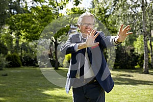 Gesticulate man in the garden