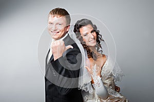 Gesticulating bride and groom photo