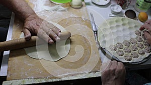 Gesture of rolling dough on cutting board in preparation of a delicious recipe