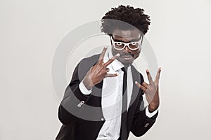 Gesture of shock, cool sing fingers. African man showing fingers