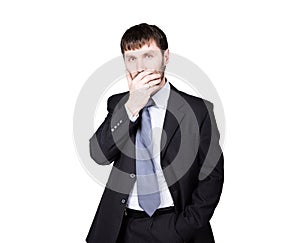 Gestures distrust lies. body language. man in business suit, hand closes his lips. isolated on white background. concept