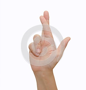 A gesturing good luck symbol fingers crossed human hand