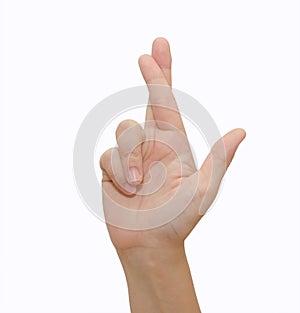 A gesturing good luck symbol fingers crossed human hand photo