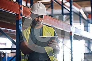 Get all the info where and when you need it. Shot of a builder using a digital tablet while working at a construction