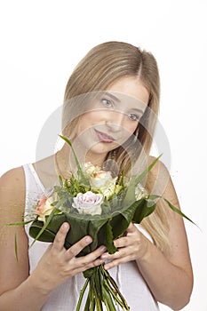 She get a bouquet of flowers (roses) for her birthday