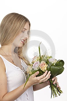 She get a bouquet of flowers (roses) for her birthday