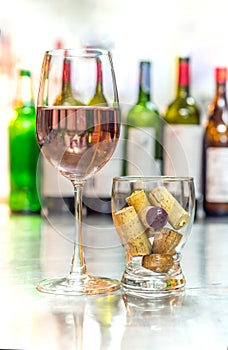 Get drunk with rose wine, soft drink in glass with cork