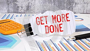 Get More Done Text written on notebook page, red pencil on the right. Motivational Concept image