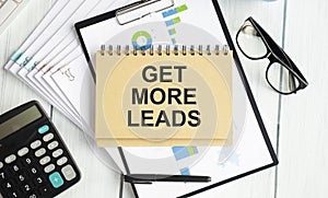 Get More Leads text as memo on notebook