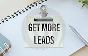 Get More Leads text as memo on notebook with tablet and pen