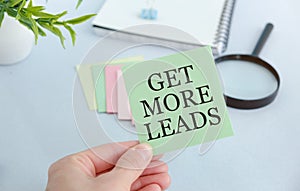 Get More Leads text as memo on notebook with tablet and pen