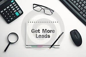 Get More Leads text on notepad. Business Concept