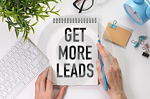 Get More Leads text on notepad. Business Concept.