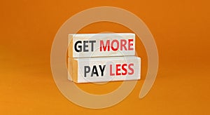 Get more pay less symbol. Concept words Get more pay less on wooden blocks on a beautiful orange table orange background. Business