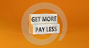 Get more pay less symbol. Concept words Get more pay less on wooden blocks on a beautiful orange table orange background. Business