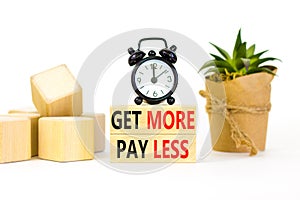 Get more pay less symbol. Concept words Get more pay less on wooden blocks on a beautiful white table white background. Black