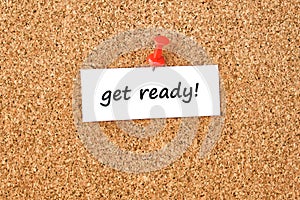 Get ready. Text written on a piece of paper, cork board background