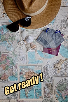 Get Ready to travel with map,Covid mask and holiday things, copy space