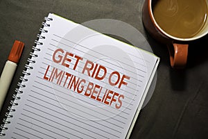 Get Rid Of Limiting Beliefs text on the book isolated on office desk background