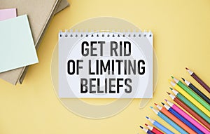 Get Rid Of Limiting Beliefs text quote on notepad