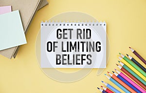 Get Rid Of Limiting Beliefs text quote on notepad photo