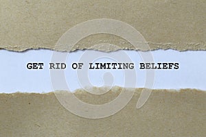 get rid of limiting beliefs on white paper photo