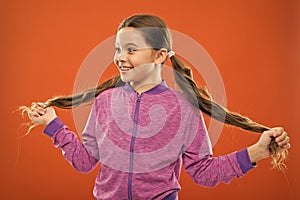 Get rid of split ends. Girl cute child with long hair double ponytails hairstyle. Split ends treatment. How to prevent
