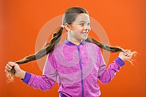 Get rid of split ends. Girl cute child with long hair double ponytails hairstyle. Split ends treatment. How to prevent