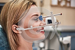 Get the smile you`ve always wanted! Dentist`s checking the result of orthodontic treatment. Side view