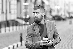 Get some rest after hard day. Man bearded hipster drink coffee paper cup. Businessman well groomed enjoy coffee break