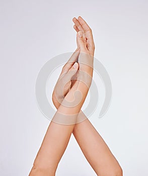 Get in touch with your beautiful self. Studio shot of an unrecognisable womans beautiful hands against a grey background