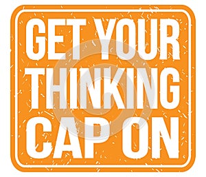 GET YOUR THINKING CAP ON, text written on orange stamp sign