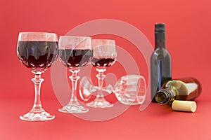 Getting drunk from red wine in elegant crystal glasses
